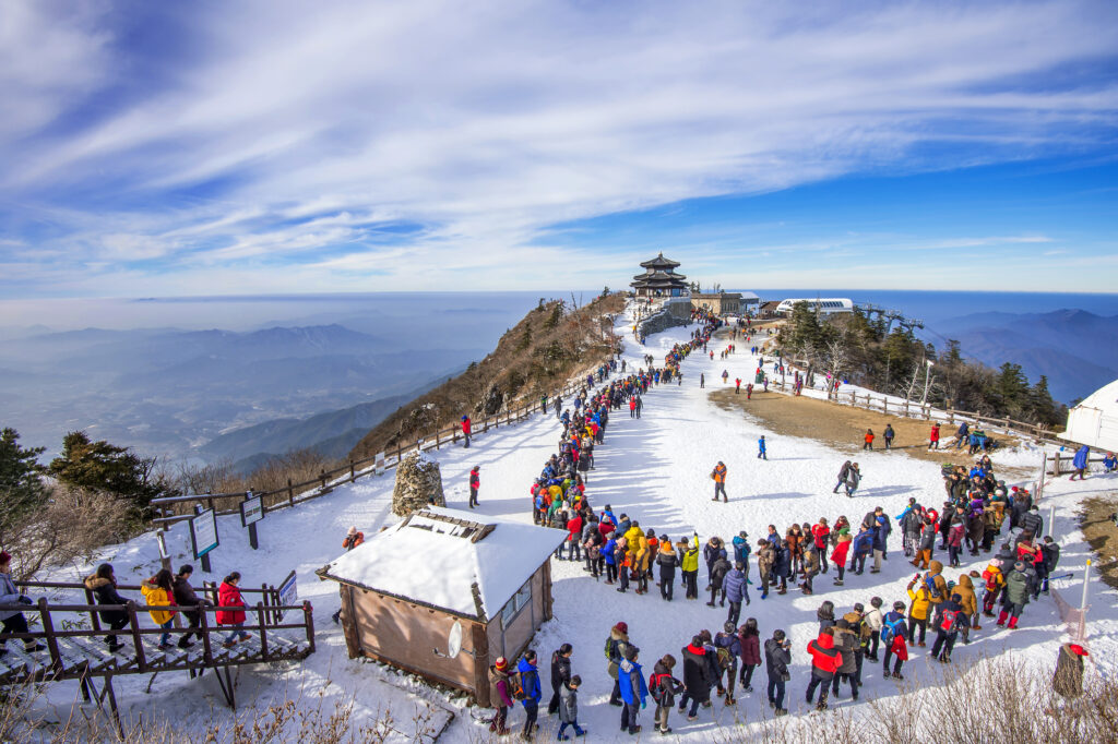 History of Char Dham Yatra – From Ancient Times Till Now tourists taking photos beautiful scenery skiing around deogyusan 1